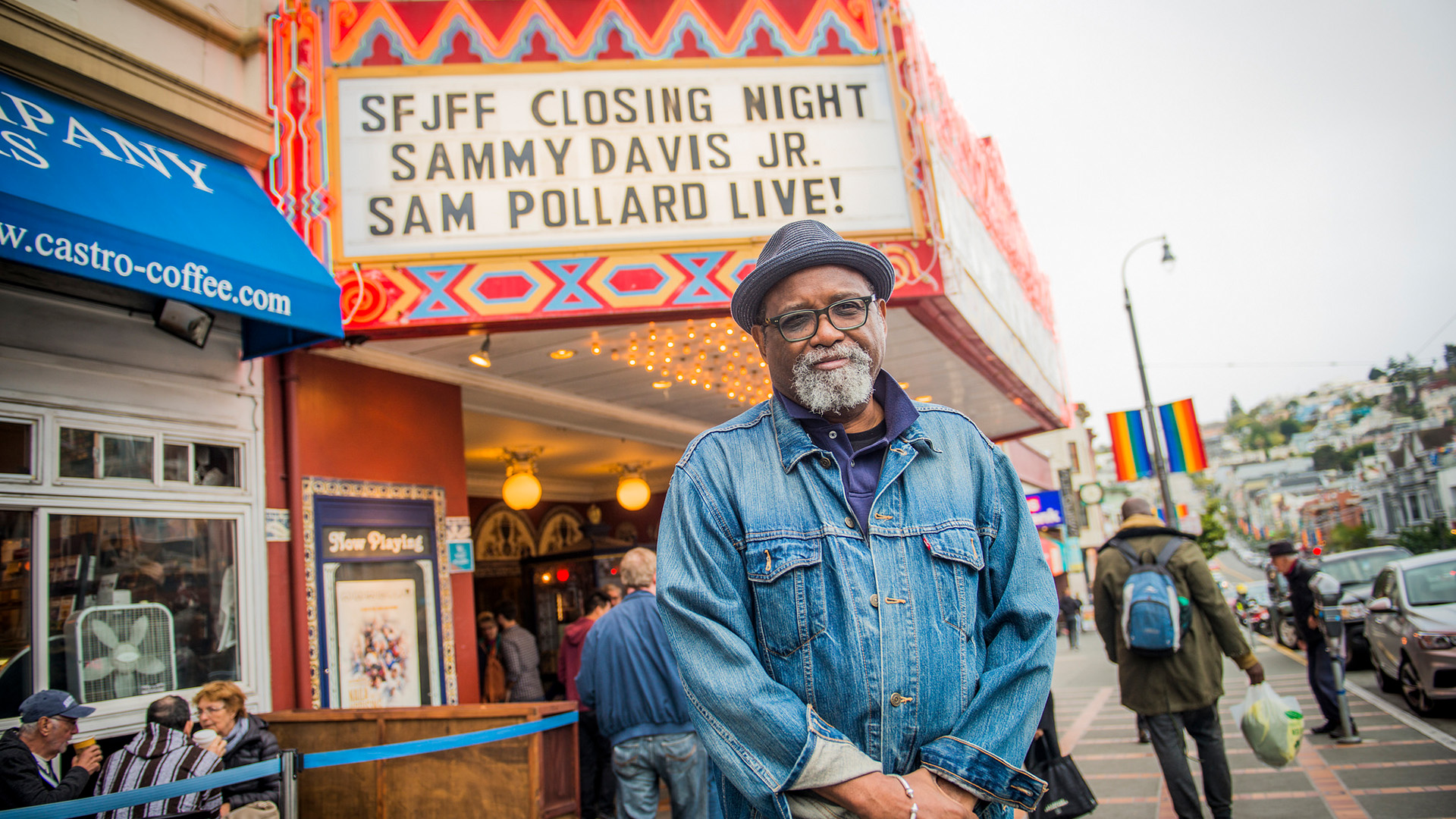 Still of Sam Pollard in front of the Castro Theatre